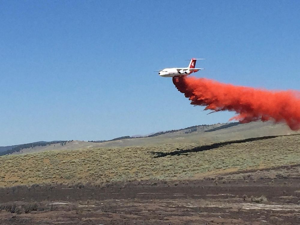 An Air Tanker drops fire retardant on the Hatchery Fire located in the Bighorn National Park near Ten Sleep, WY began on…