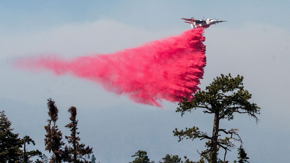 Cedar Fire aerial fire retardant operations on Black Mountain in the U.S. Department of Agriculture (USDA) Forest Service…