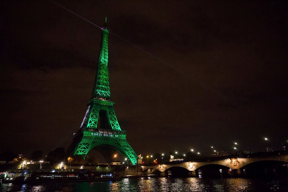 The Eiffel Tower Is Illuminated in Green to Celebrate Paris Agreement's Entry into Force