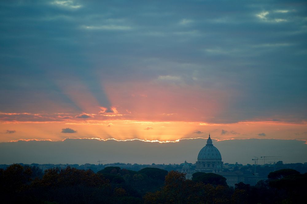 Sunset as seen against St. Peter's Basilica. Original public domain image from Flickr