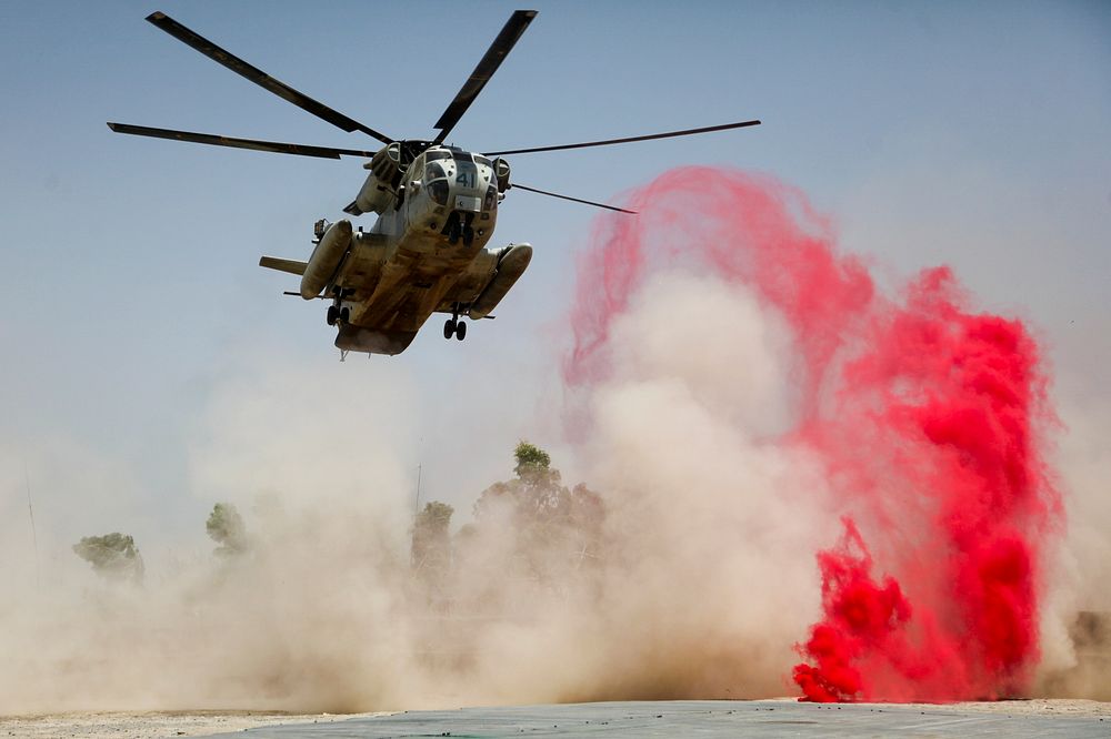 A U.S. Marine Corps CH-53D Sea Stallion helicopter lands to deliver supplies at Patrol Base Jaker, Afghanistan, July 28…