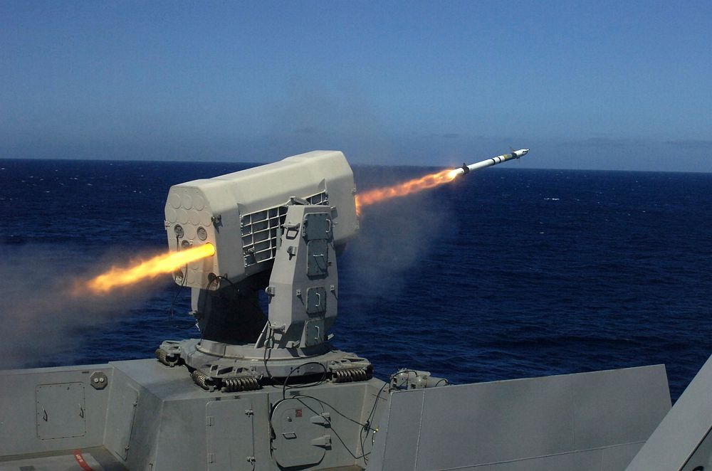 A surface-to-air intercept missile fires from a Rolling Airframe Missile launcher aboard USS Green Bay (LPD 20) Sept. 29…