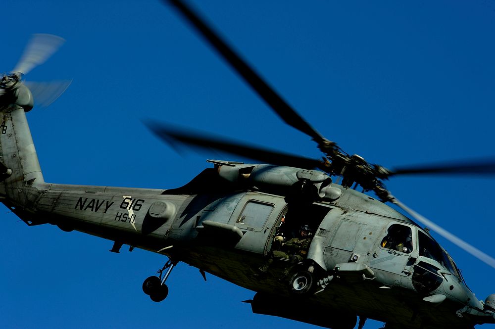 A U.S. Navy UH-60 Seahawk helicopter takes off from the Toussaint L?Ouverture International Airport in Port-au-Prince…