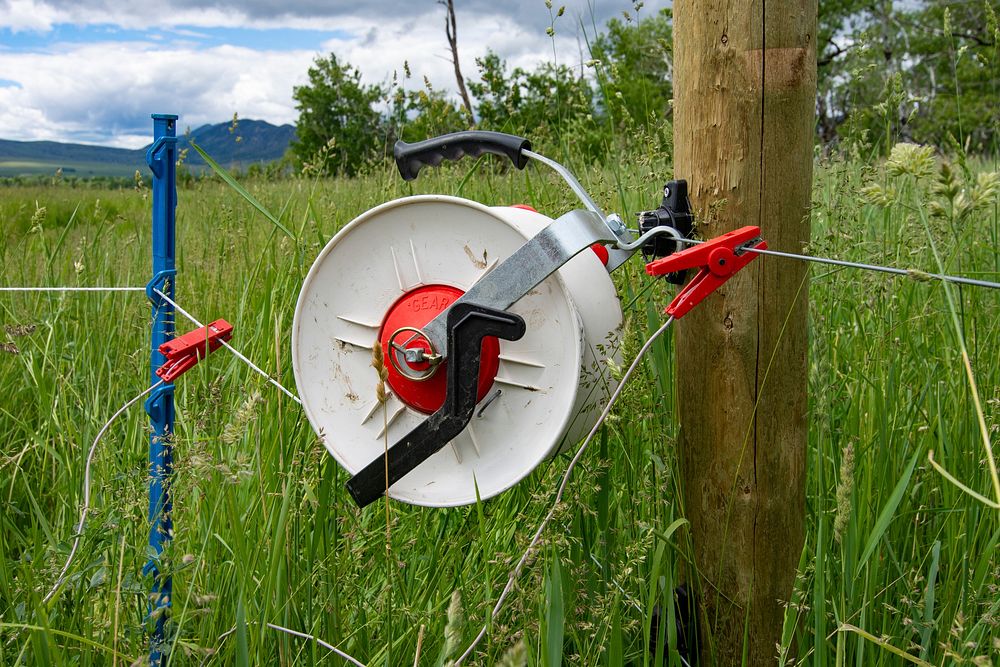 An electric fence keeps livestock from grazing in areas that need rest. Photo taken June 21, 2019 at Barney Creek Livestock…
