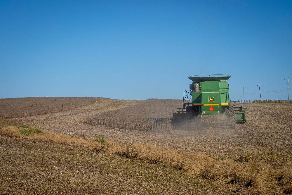 A farmer harvests a soybean field near New London, Md., October 17, 2020. USDA/FPAC photo by Preston Keres. Original public…