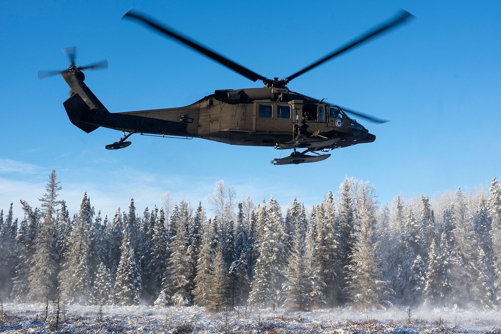 An Alaska Army National Guard UH-60L Black Hawk helicopter assigned to the 1st Battalion, 168th Aviation Regiment, carrying…