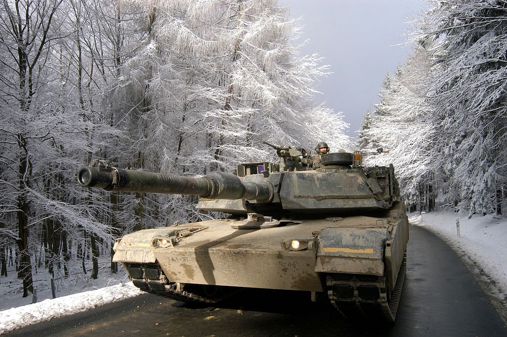 FRANKFURT, Germany -- Members of the 1st Armored Division drive an M-1A Abrams tank through the Taunus Mountains north of…