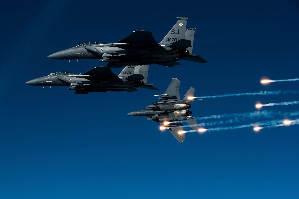A U.S. Air Force F-15E Strike Eagle aircraft with the 335th Fighter Squadron releases flares during a local training mission…