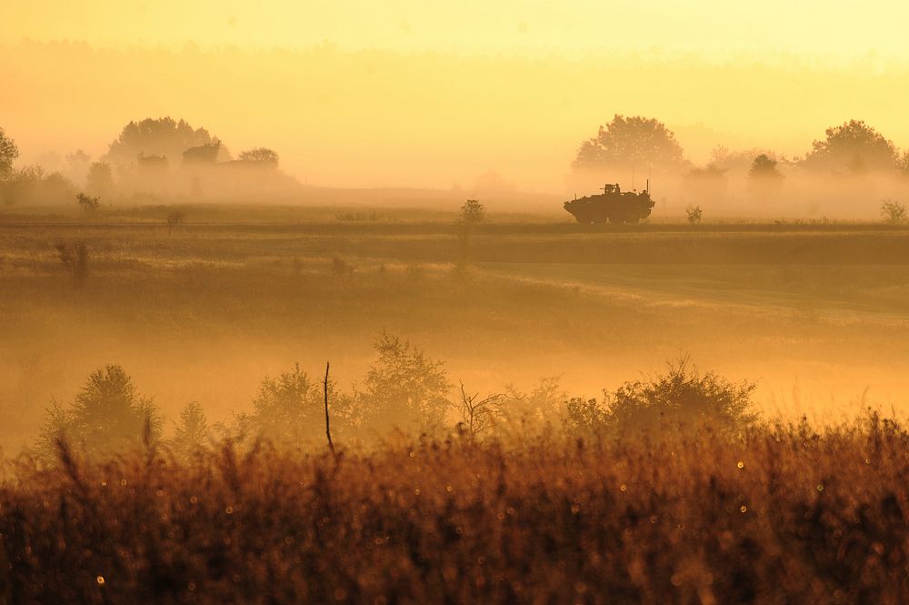 GRAFENWOEHR, Germany -- A U.S. Army Europe Stryker vehicle patrols along a German country road, during Saber Junction 2012…