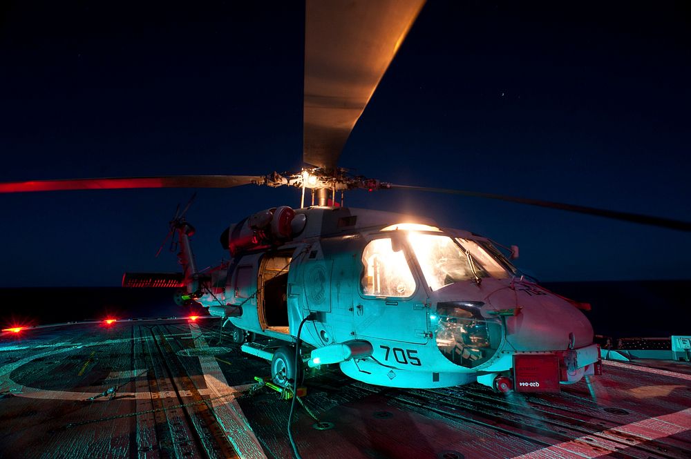 A U.S. Navy SH-60B Seahawk helicopter with Helicopter Anti-Submarine Squadron Light (HSL) 51 sits chocked and chained aboard…