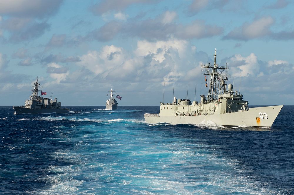 Royal Australian Navy frigate HMAS Sydney (FFG 03), right, Japan Maritime Self Defense Force destroyer JS Murasame (DD 101)…