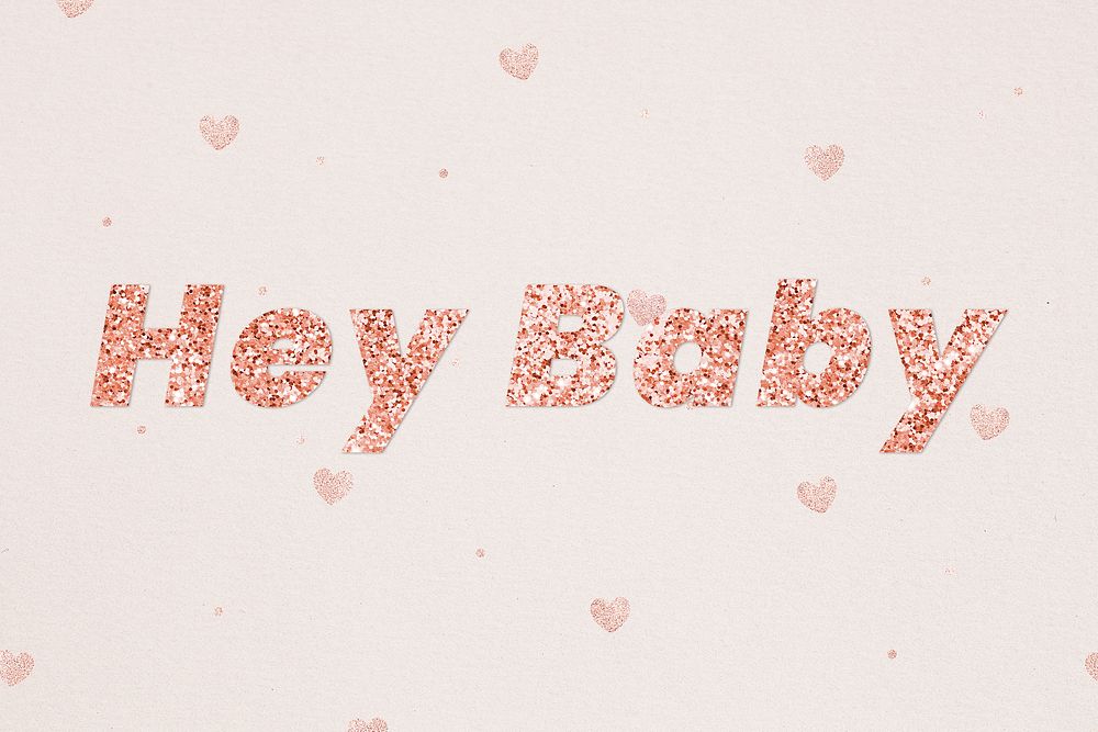Glittery hey baby typography on heart patterned background