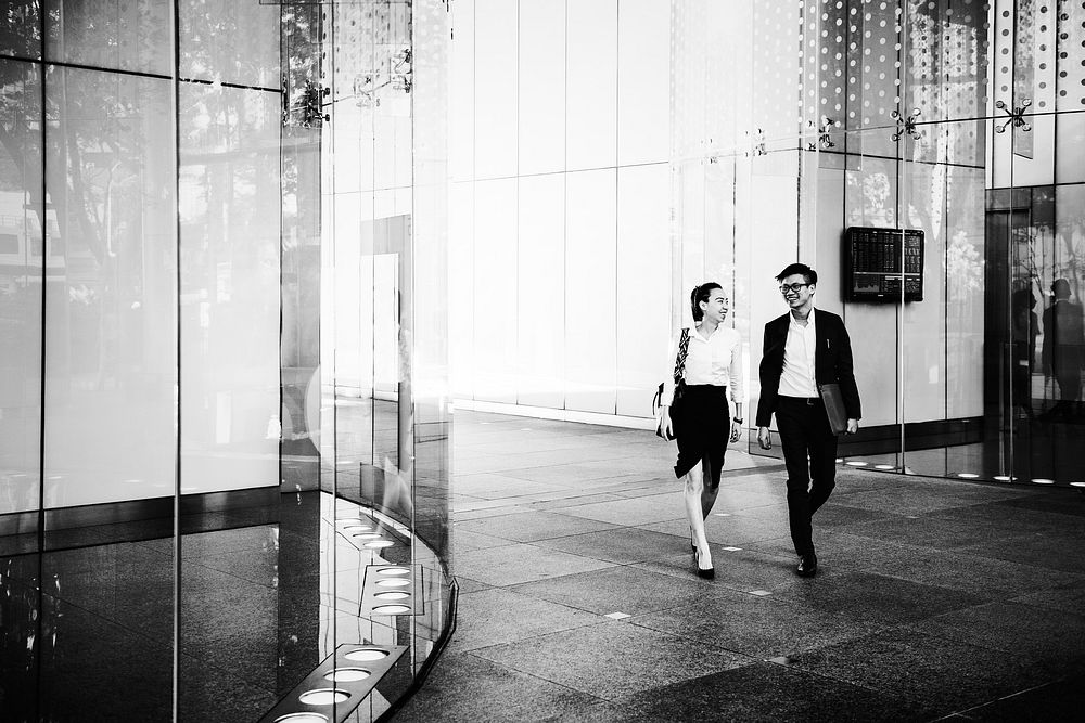 Business people in a discussion while walking together