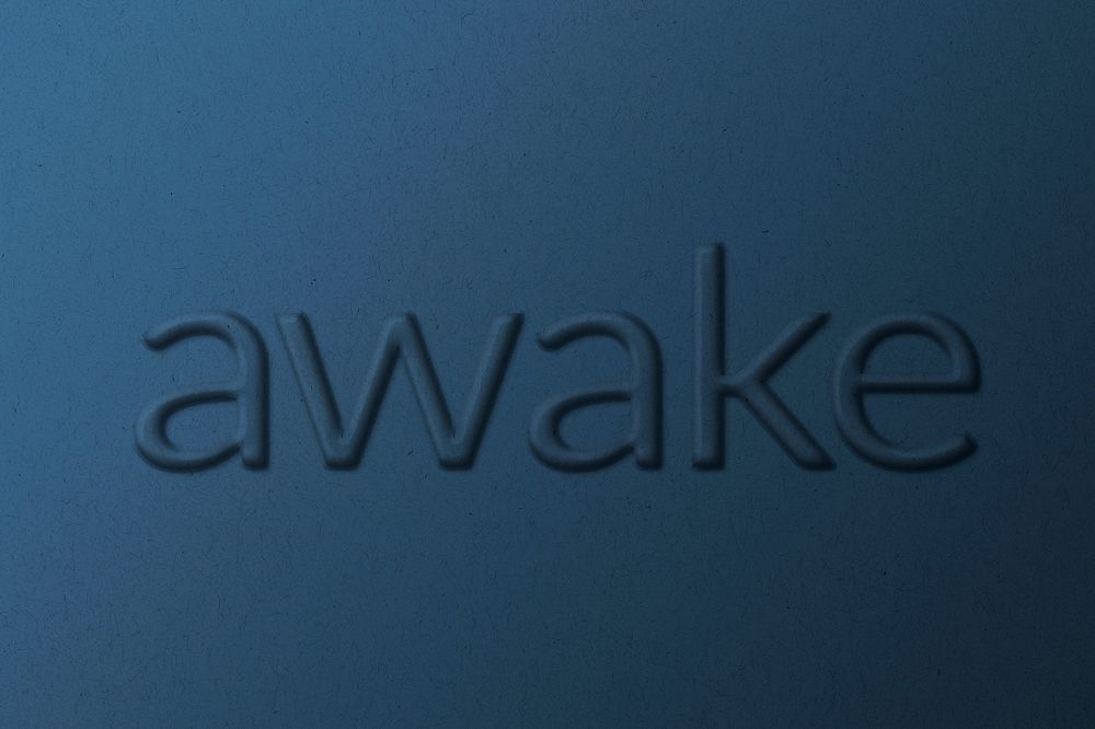 Awake word emboss typography on paper texture