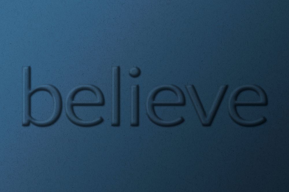 Text believe embossed typography on paper texture