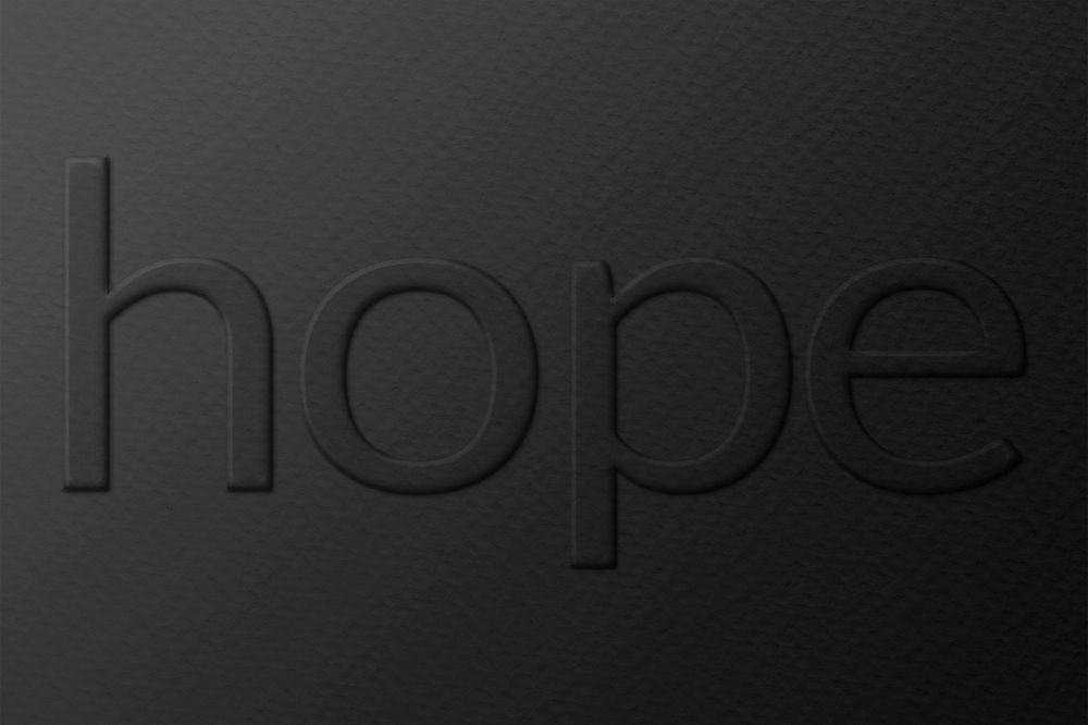 Hope embossed typography on paper texture
