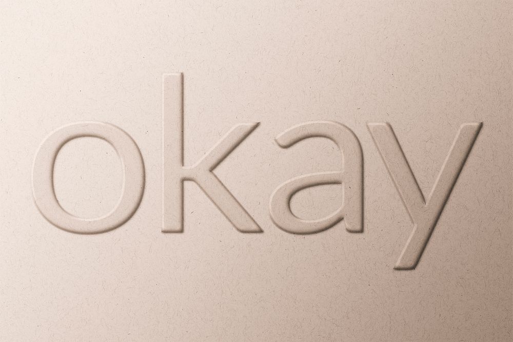 Okay word emboss typography on paper texture