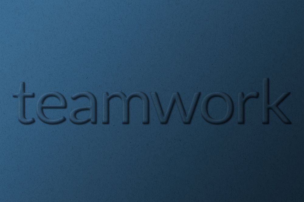 Word teamwork embossed typography on paper texture