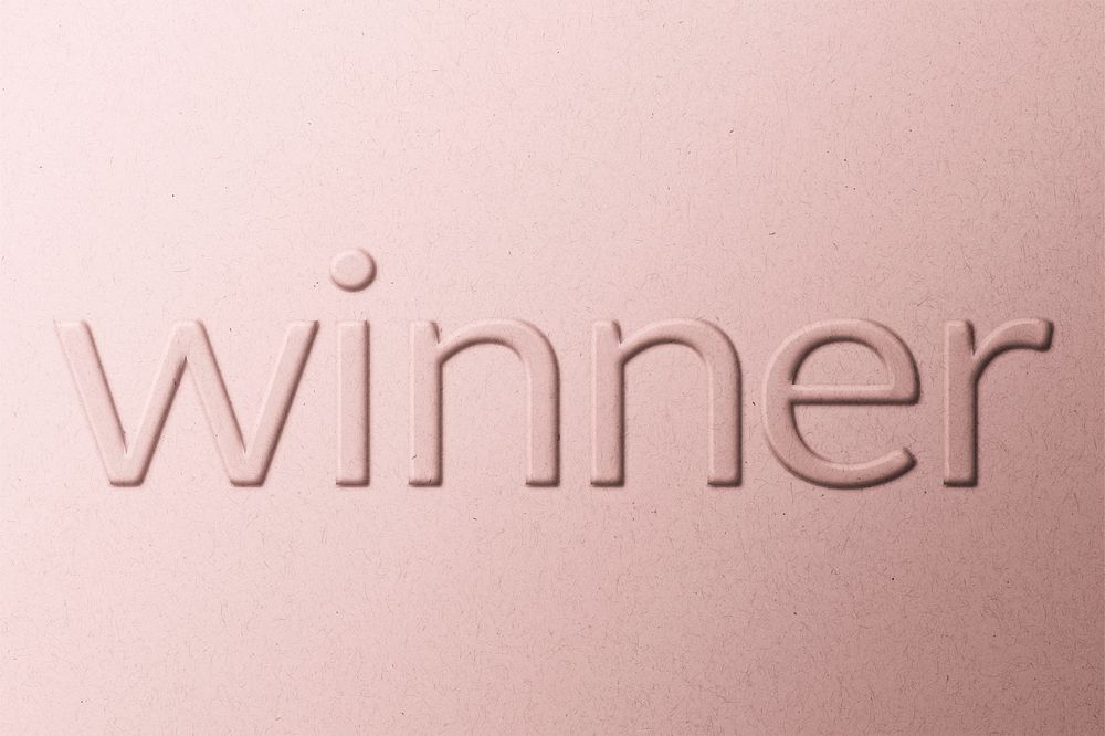 Winner word embossed typography on paper texture