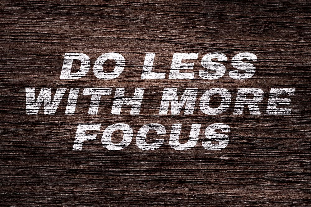 Do less with more focus text typography dark wood texture