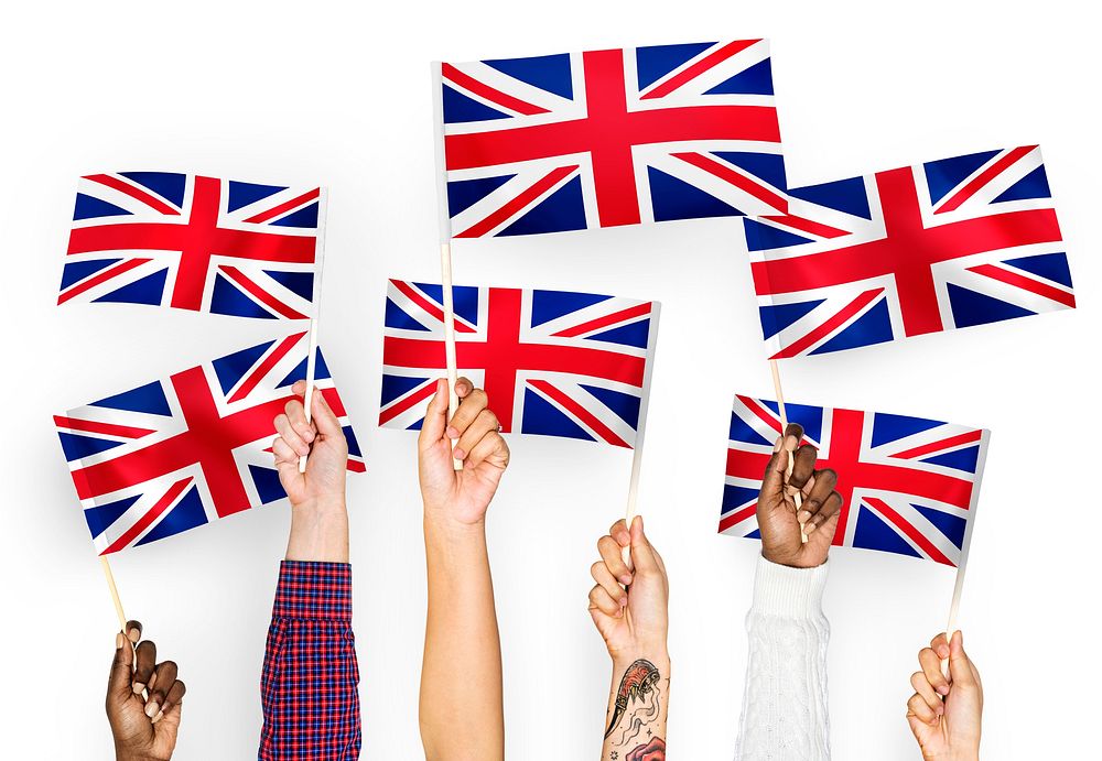 Hands waving the Union Jack