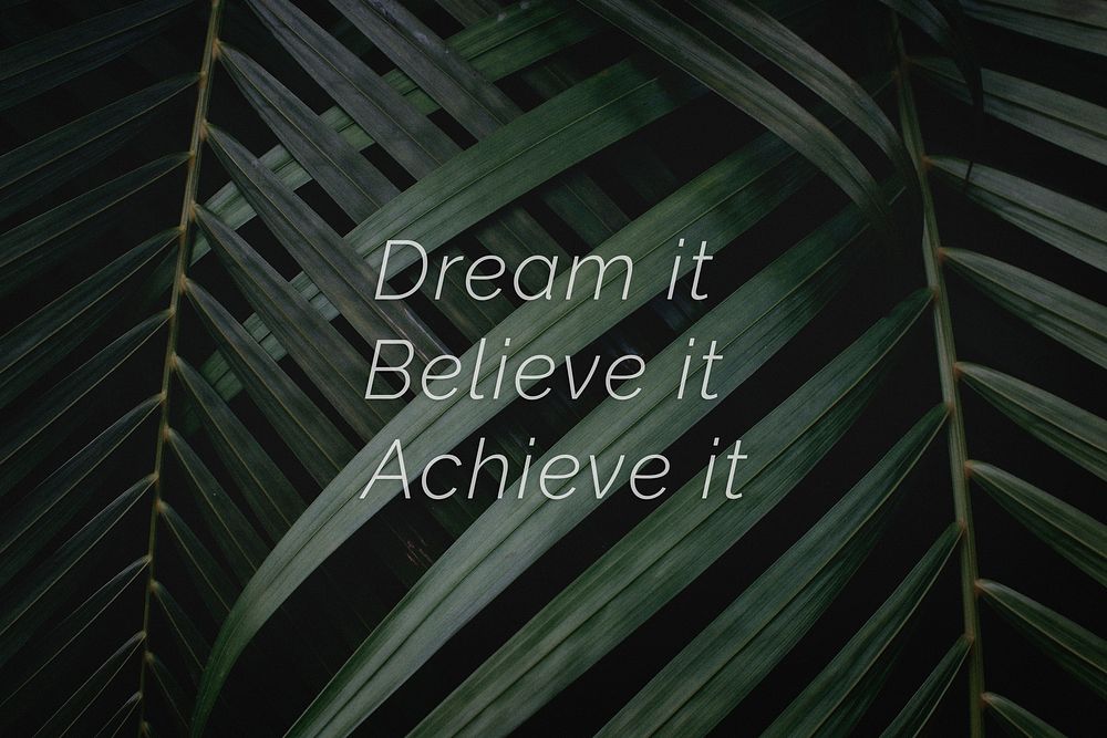 Dream it believe it achieve it quote on a palm leaves background