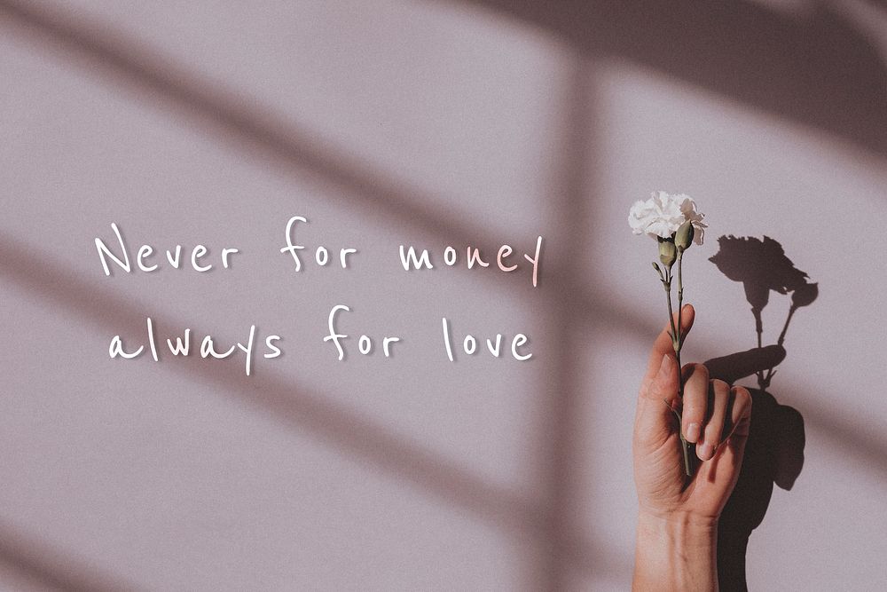 Never for money always for love quote on a hand holding flower background