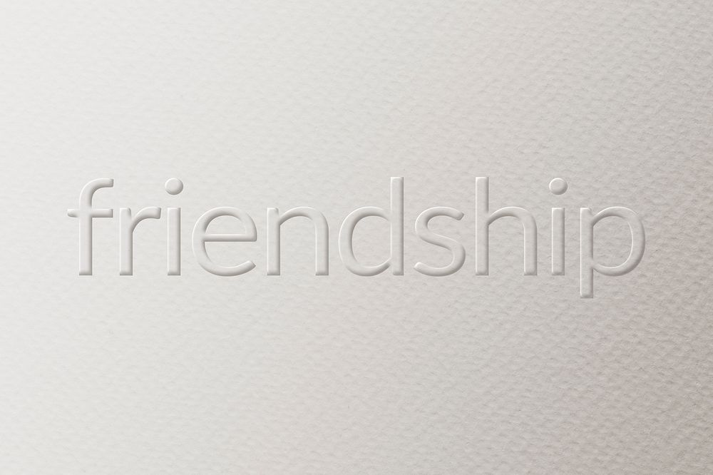 Friendship embossed font white paper background