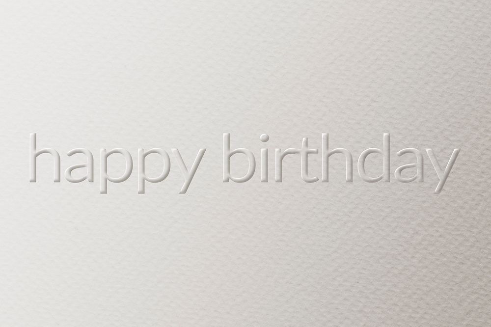 Happy birthday embossed font white paper background