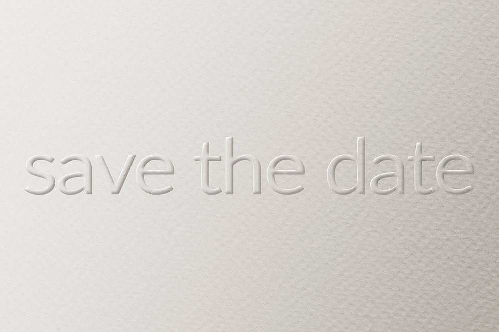 Save the date embossed text white paper background