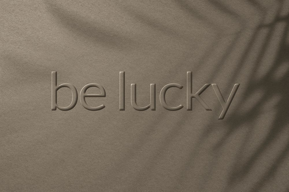 Phrase be lucky embossed typography style