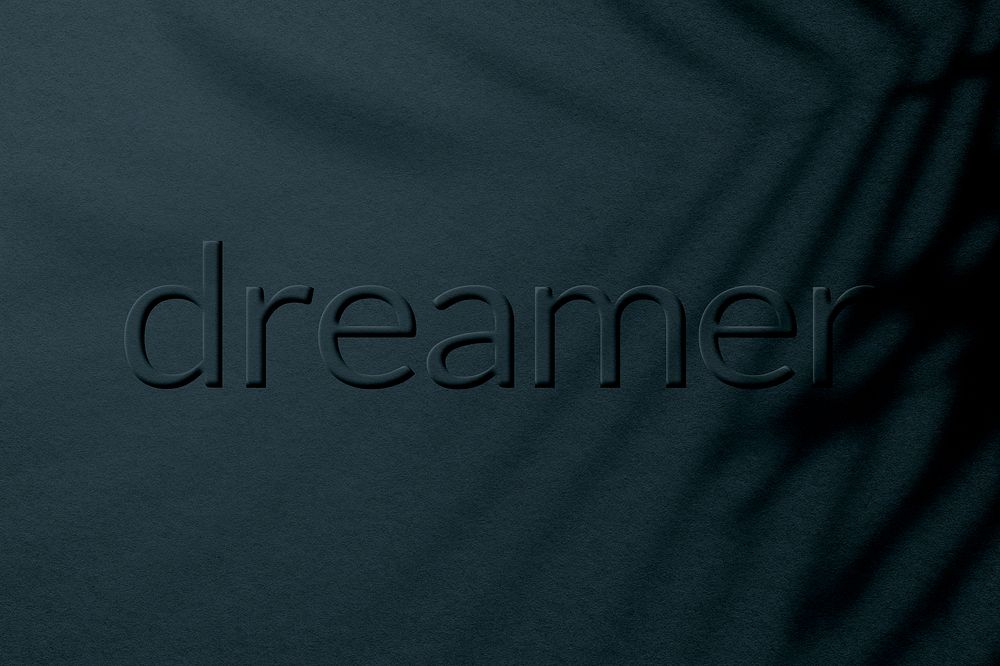 Dreamer letter embossed plant shadow textured backdrop typography