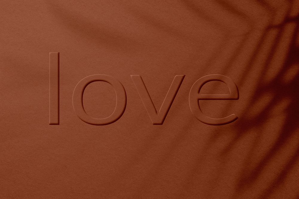 Love text embossed textured brick red typography
