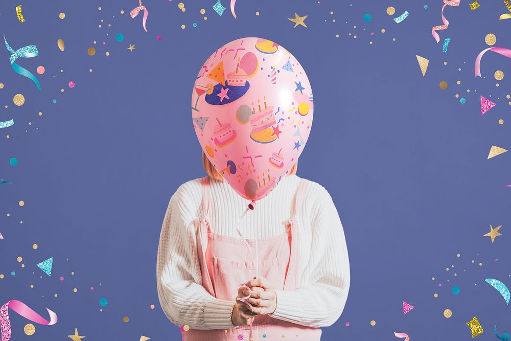 Woman holding birthday party balloon