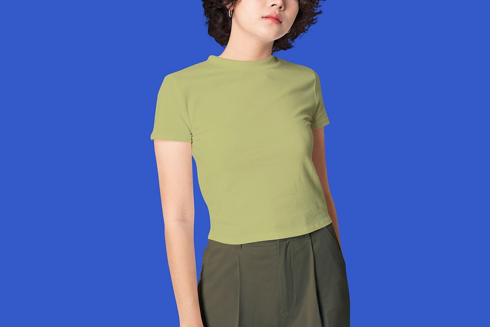 Girl wearing green t-shirt, blue background