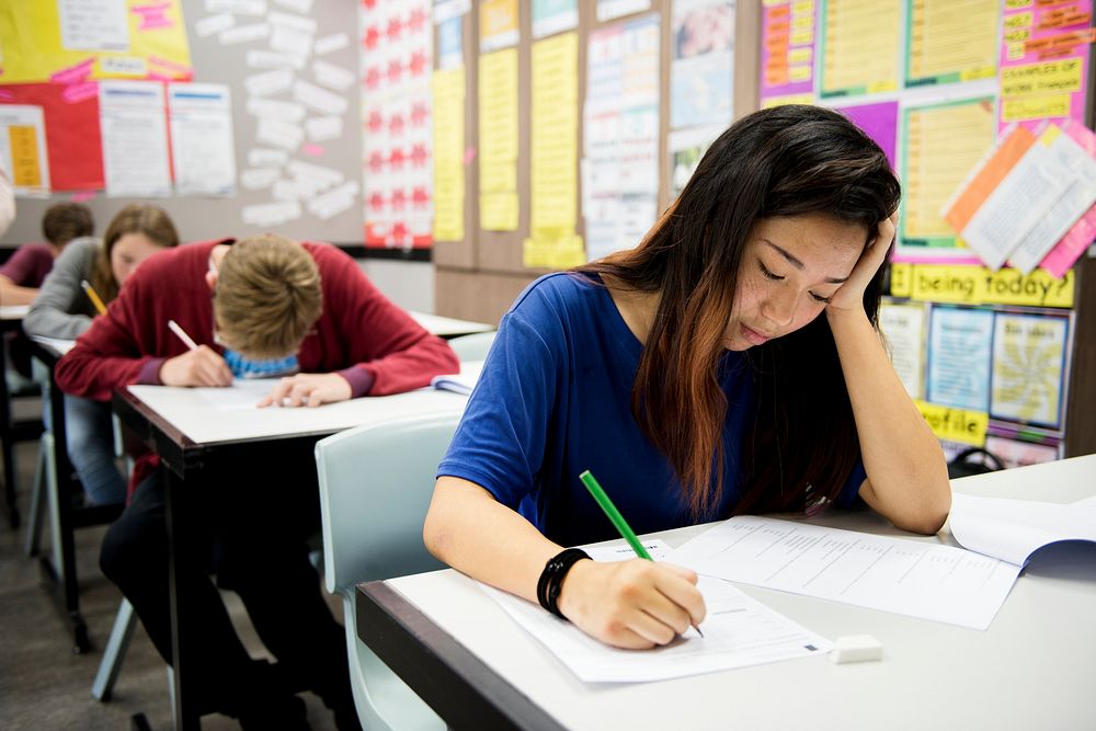 Students sitting an exam in a classroom 