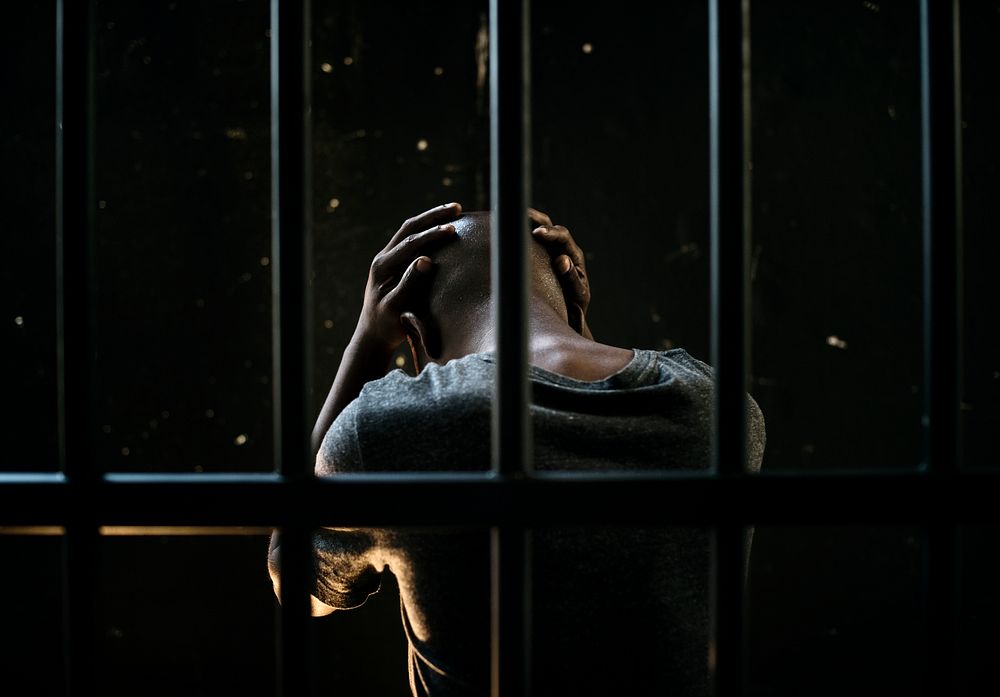 Distraught man behind bars