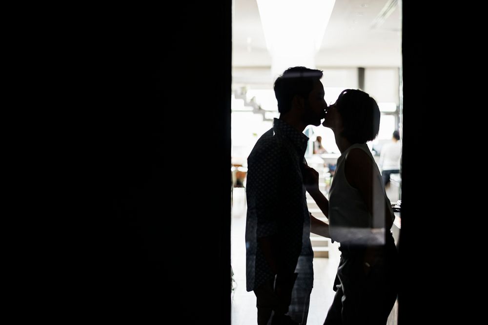 Silhouette of a couple kissing 