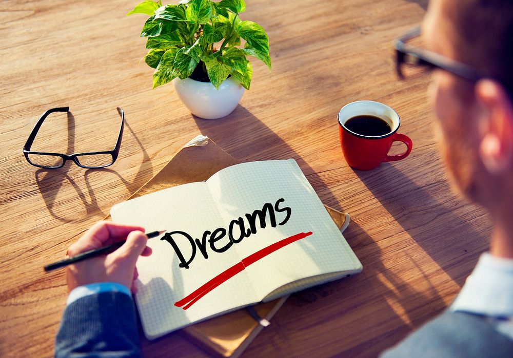 A Businessman Brainstorming About Dreams