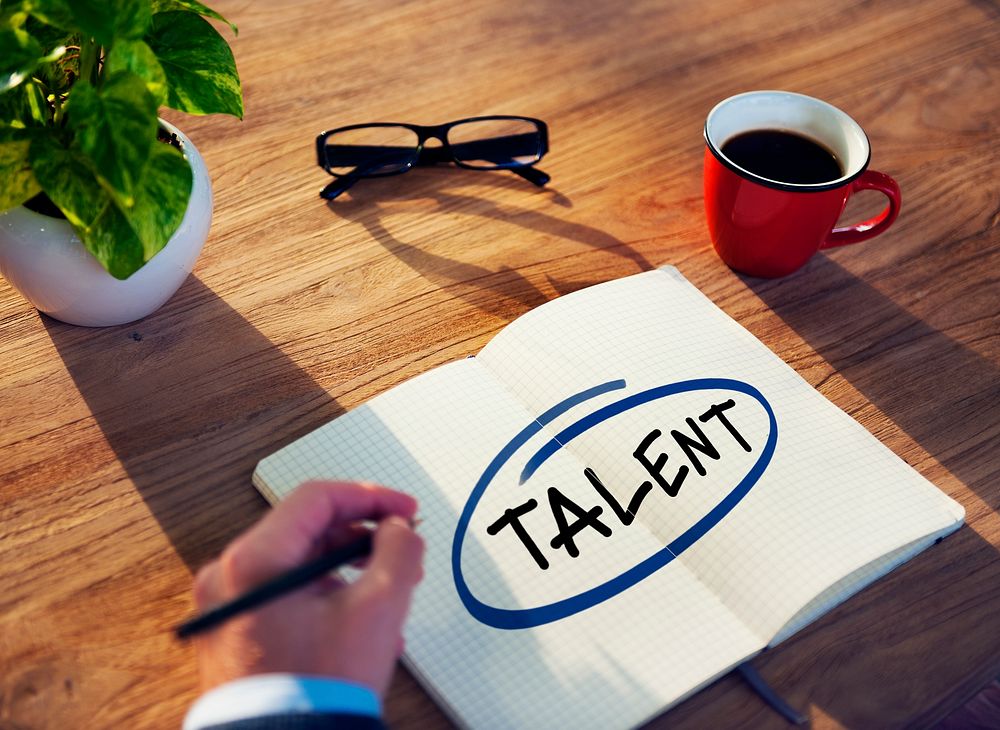 Businessman Writing the Word "Talent"