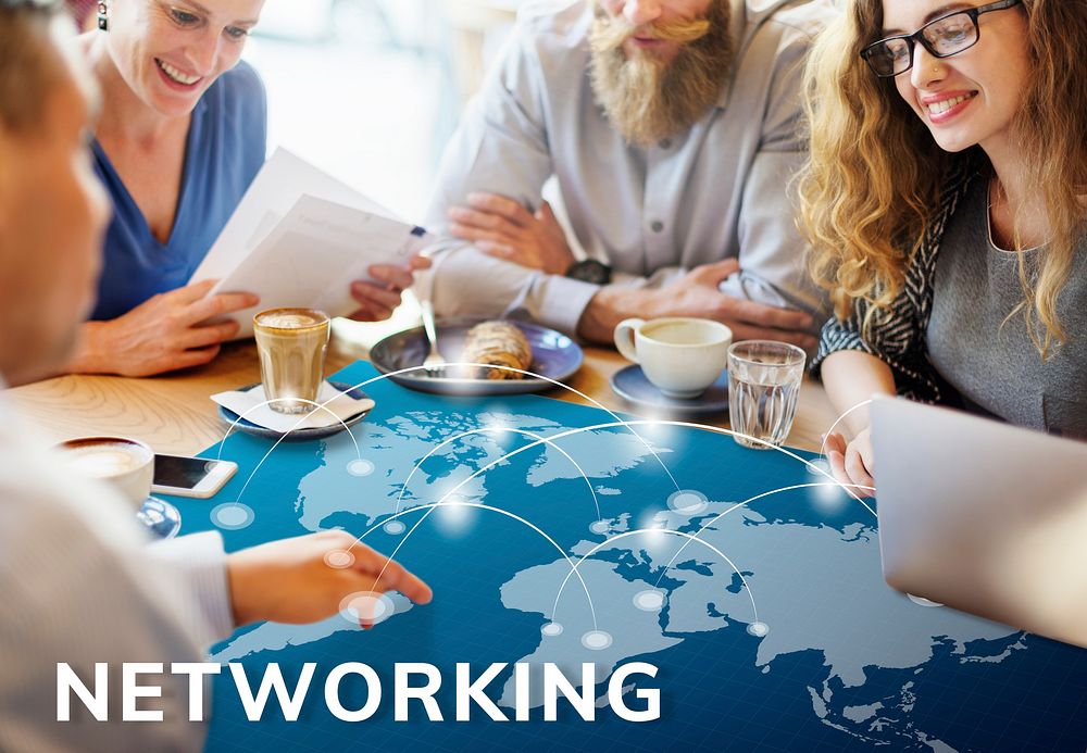 Workers working on banner network graphic on table