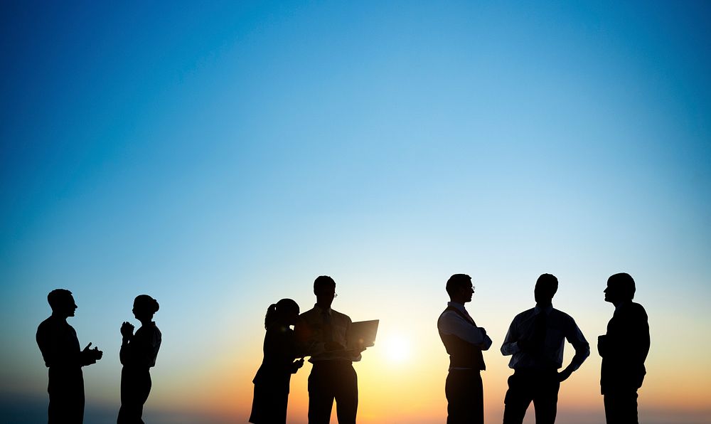 Group Of Business People Silhouettes Working Outdoors And A Copy Space Above