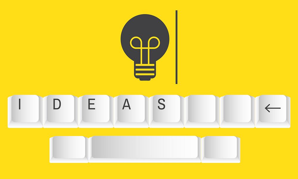 Light bulb graphic with ideas on keyboard
