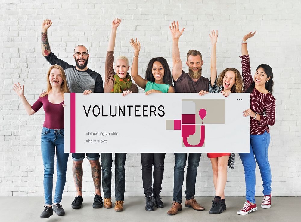 Group of people holding banner of blood donation campaign