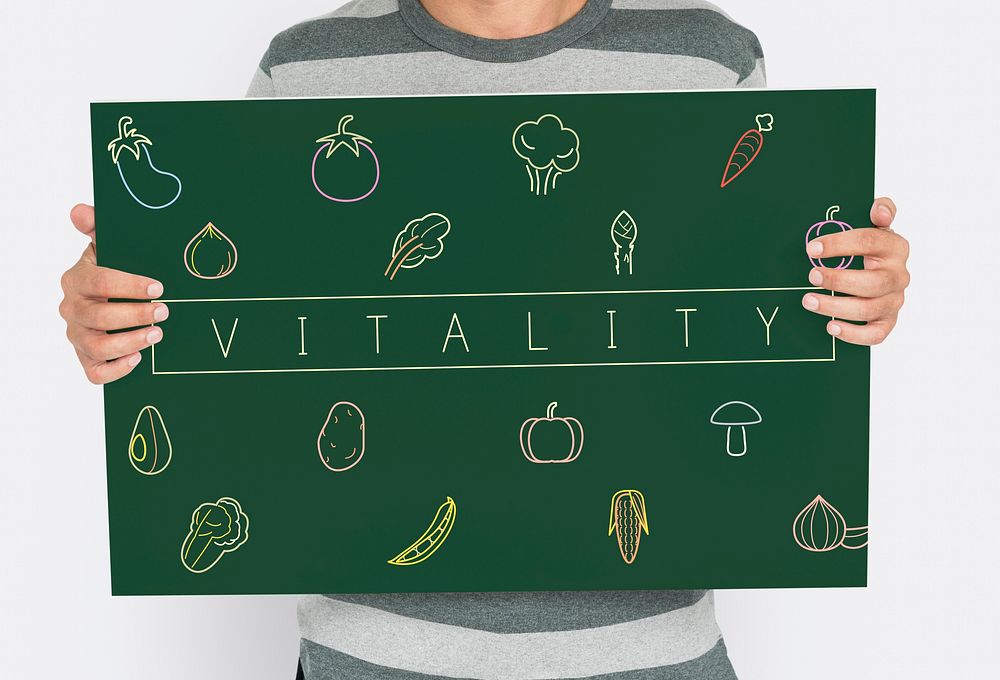 People holding a board about healthy nutrition Veggie