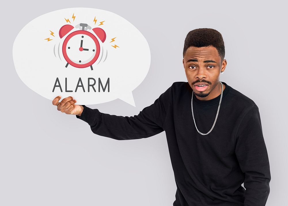 African man holding speech bubble alarm clock icon