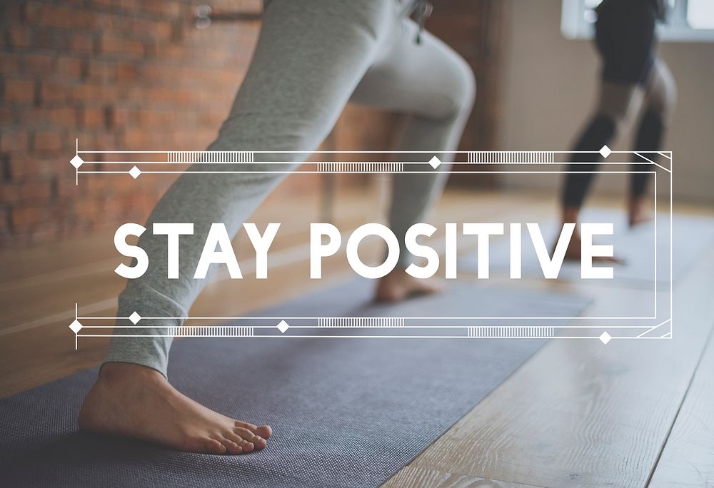 People in Yoga Class with Stay Positive Word