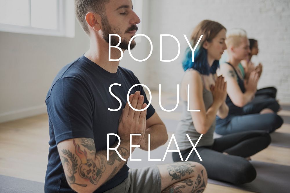 Group of people training in yoga class for body soul and mind relief
