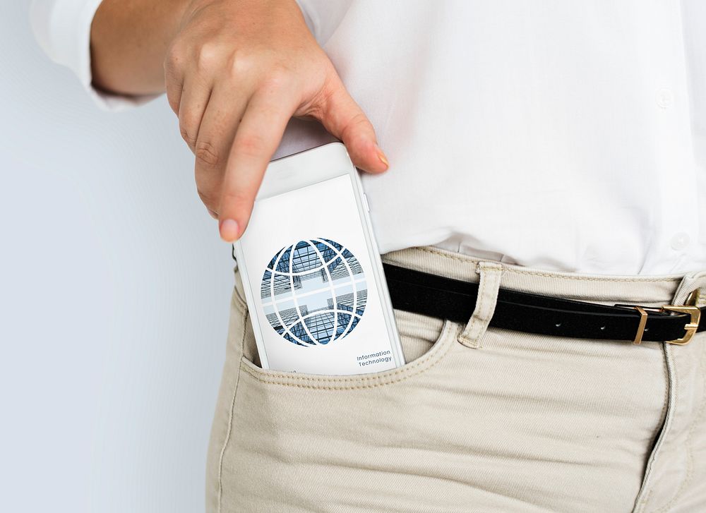 Man putting cellphone into his trouser pocket