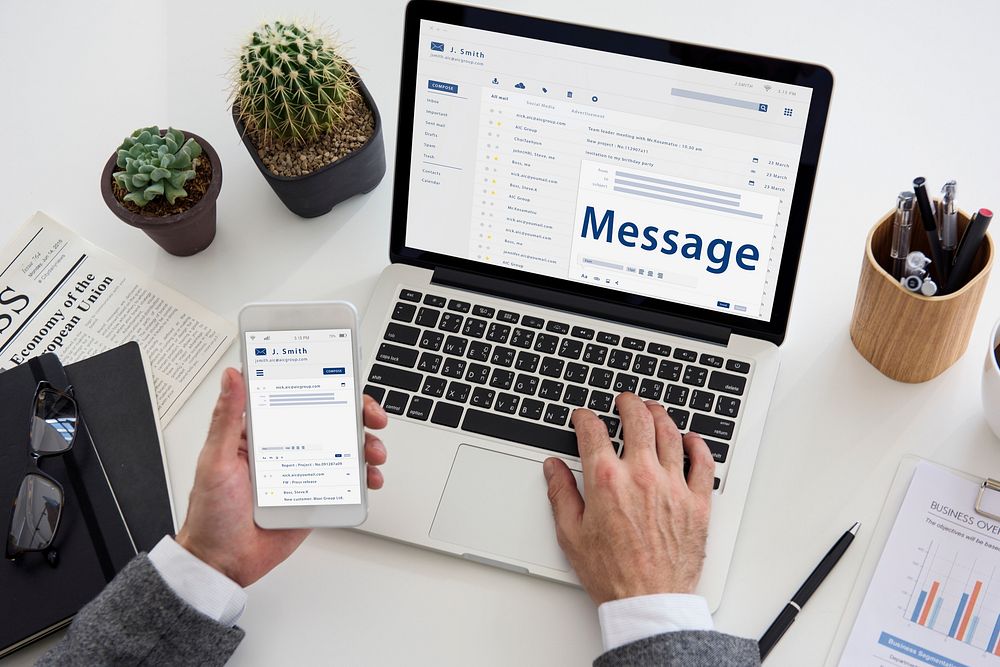 Hands composing an email on a digital device